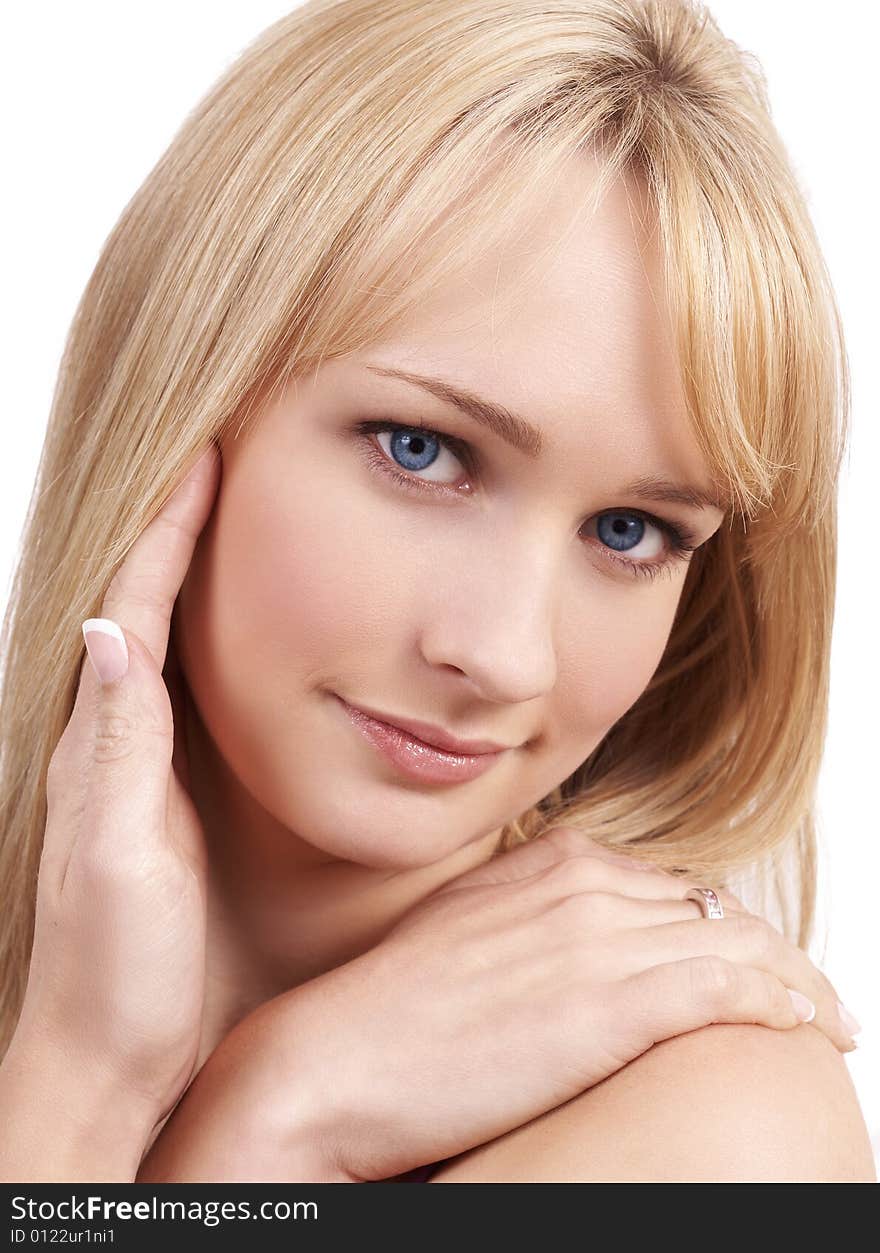 Portrait of a young beautiful blonde woman with light blue eyes and natural make-up. Portrait of a young beautiful blonde woman with light blue eyes and natural make-up