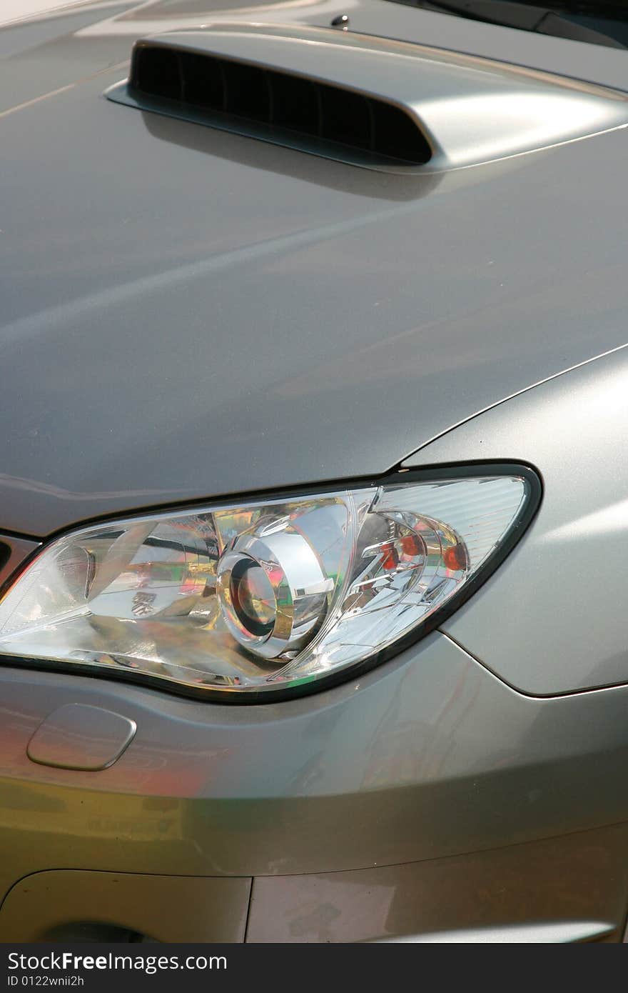 Forward headlight of the sports car of metal color