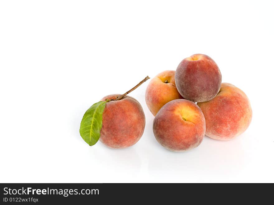 Ripe peaches isolated on white