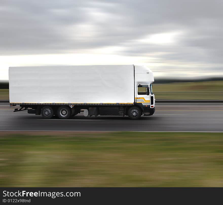 Blank truck moving on a road. Blank truck moving on a road