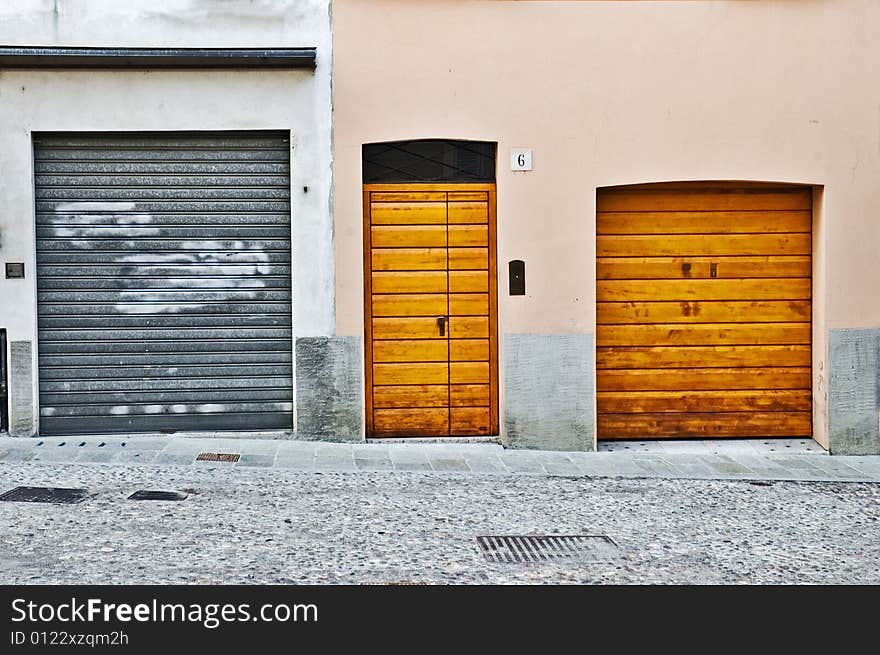 Three doors in the city of Parma, Italy