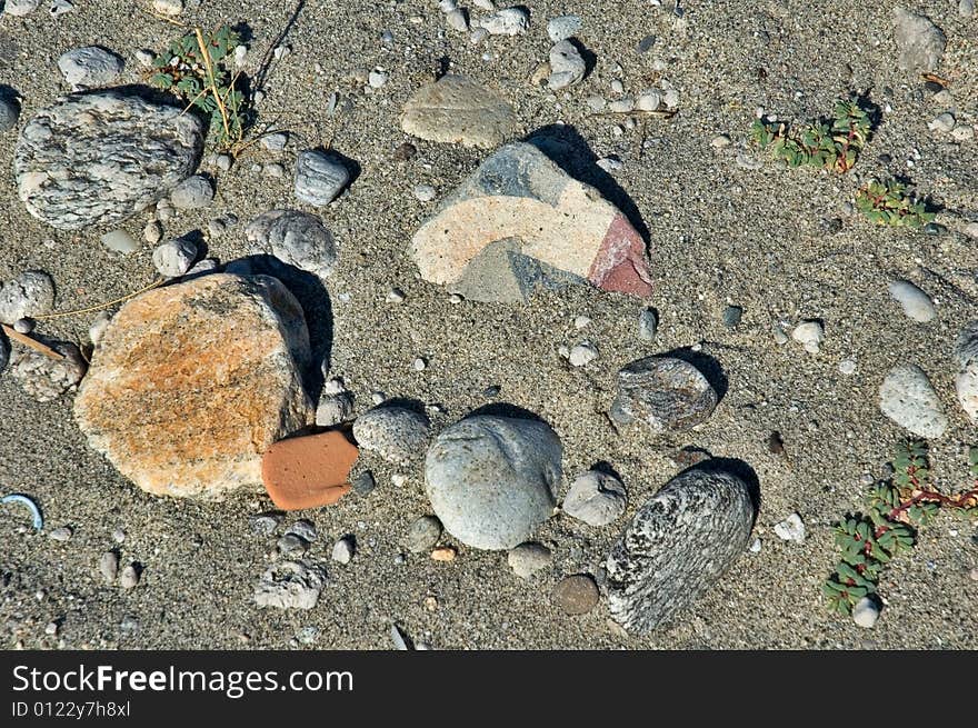 Pebbles and debris on beach sand