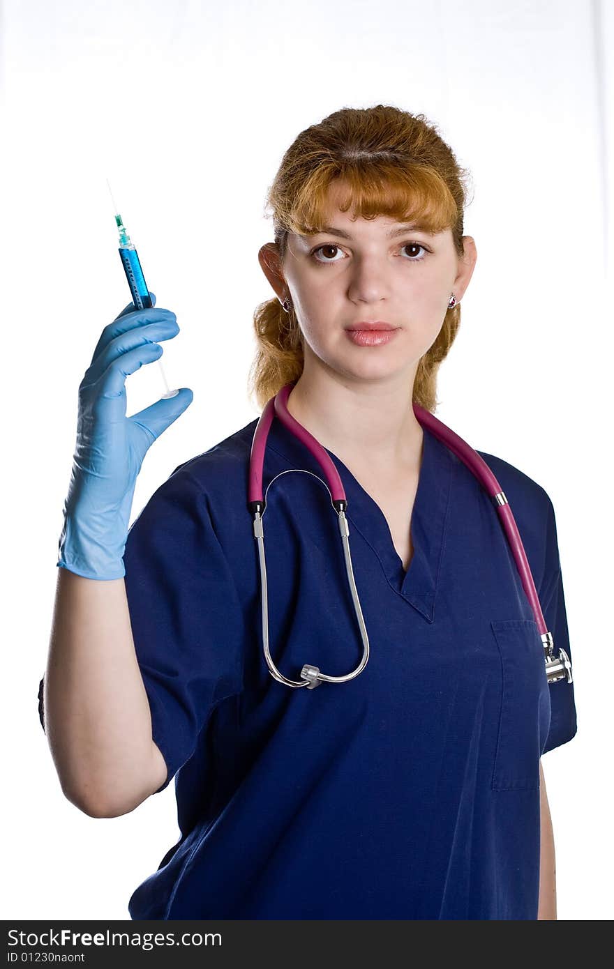 Female doctor with stethoscope and syringe over white background