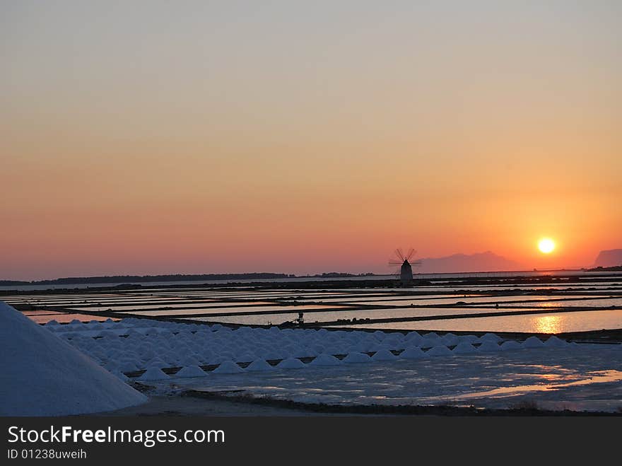 Sunset on salt-works of Marsala in SIcily