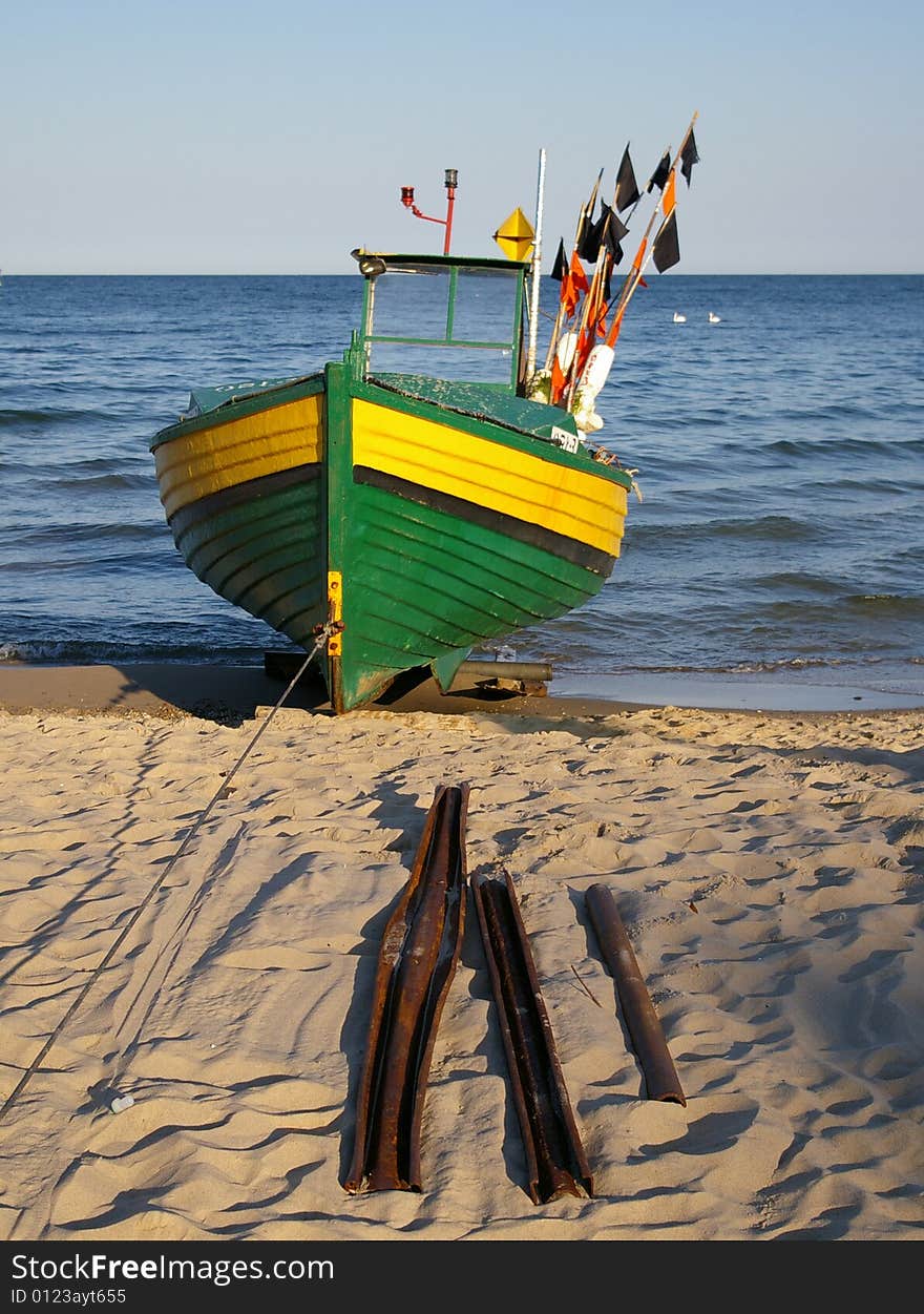 Boat next to the sea.