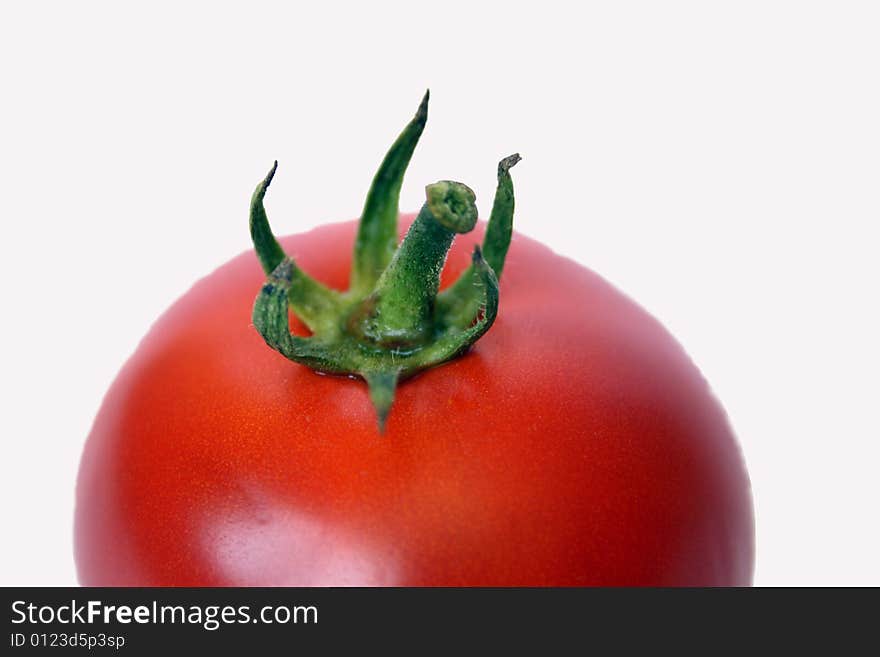 A fresh tomato isolated on white background