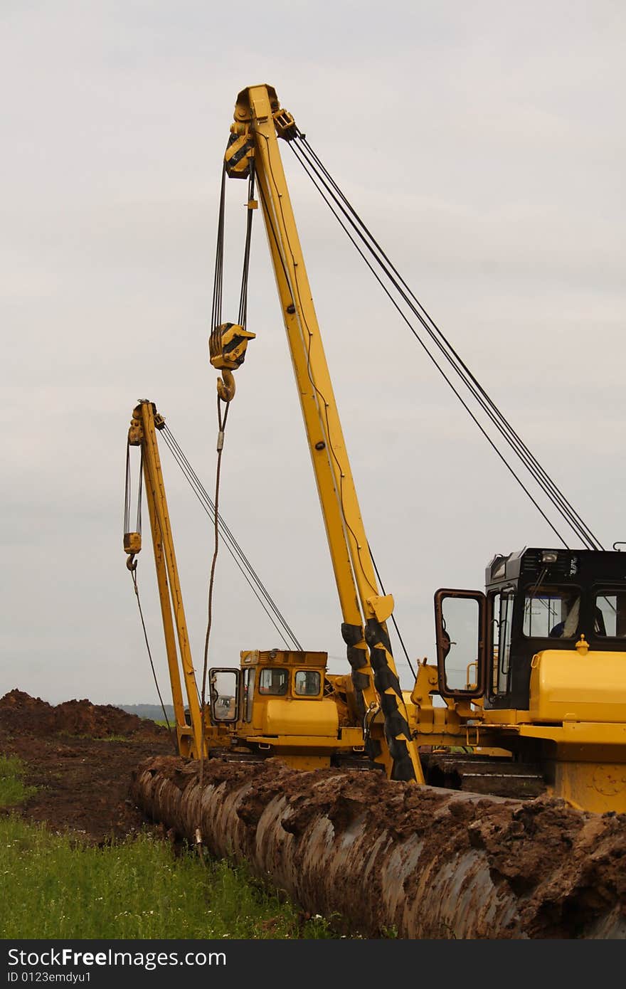 Construction of the pipeline.Two tractors.