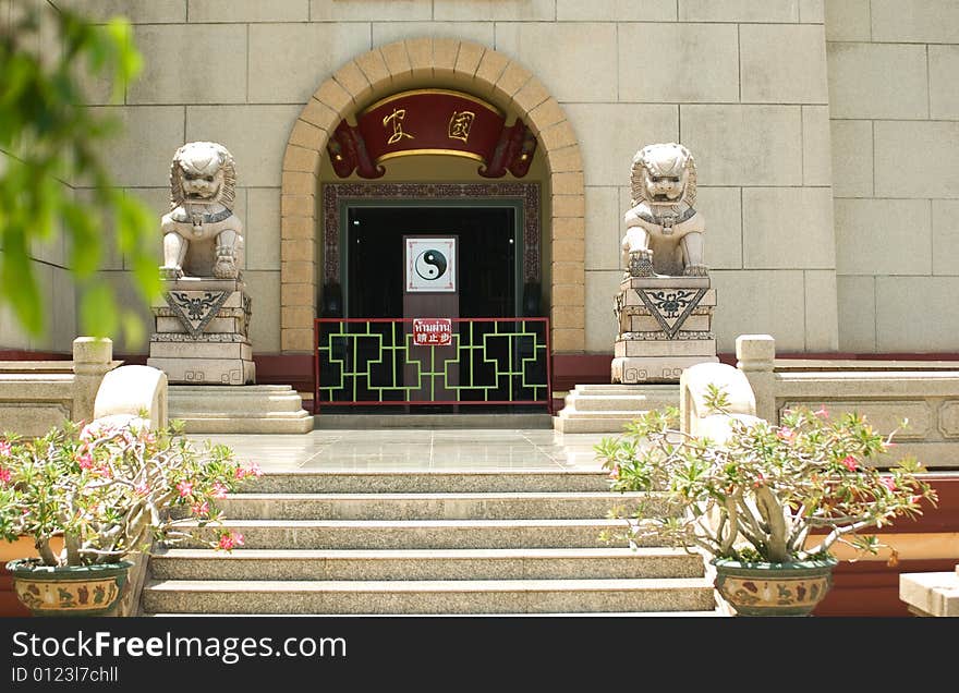 Gateway to the Chinese temple, guarded stone lions