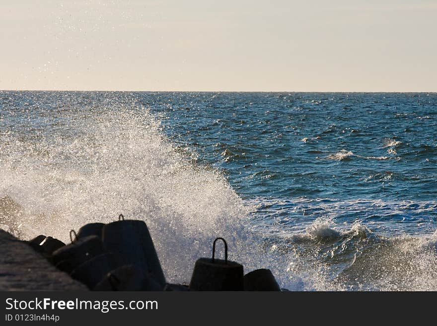 Water splash over the rocks in the sea