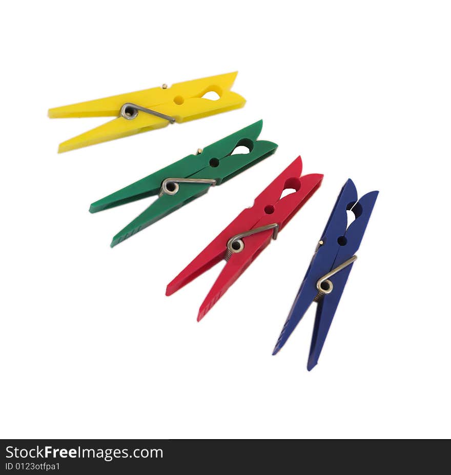 Four different colour plastic clothespines. Four different colour plastic clothespines