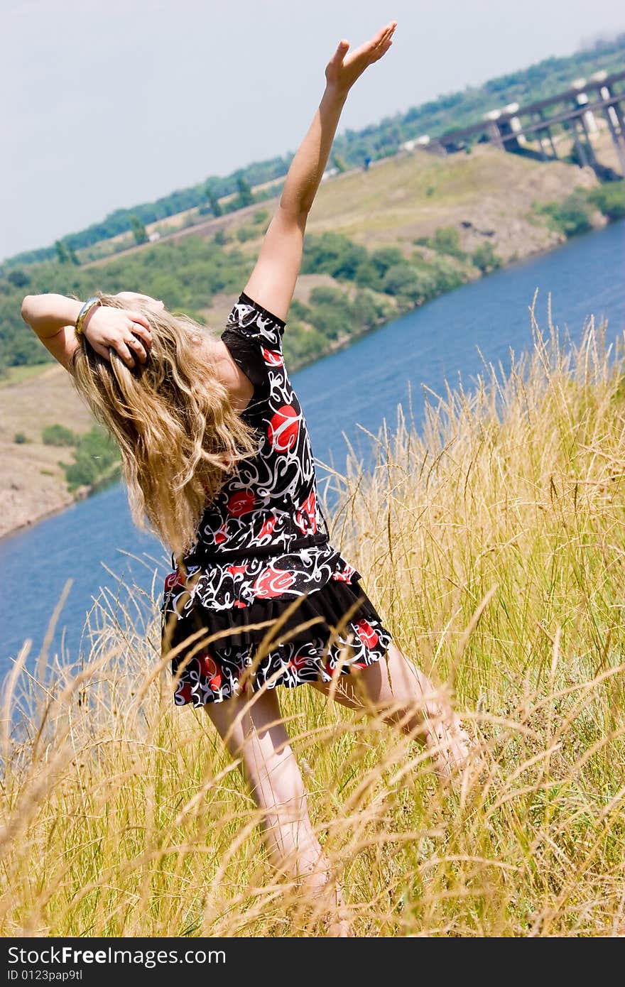 Pretty young girl on blue river background. Pretty young girl on blue river background