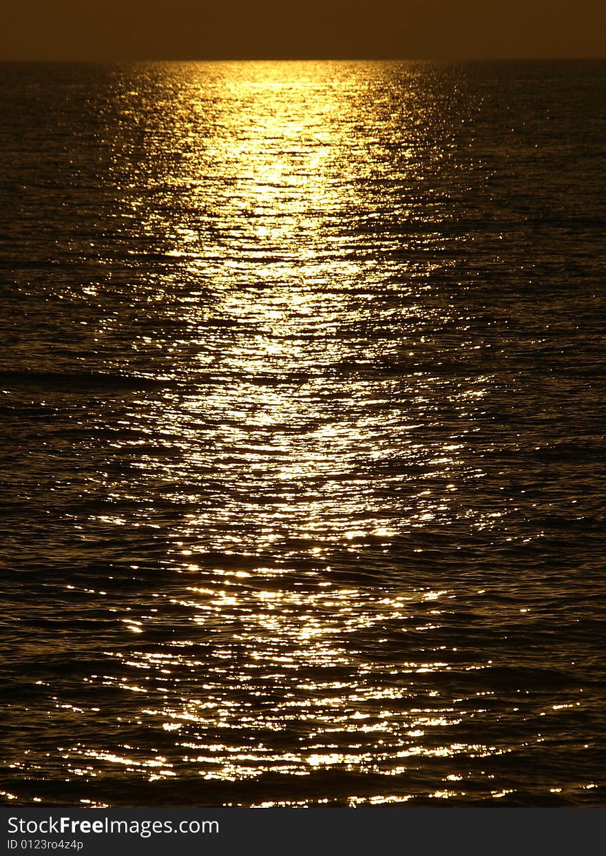 A wonderful shot of the sunlight on the sea in the sunset hour. A wonderful shot of the sunlight on the sea in the sunset hour