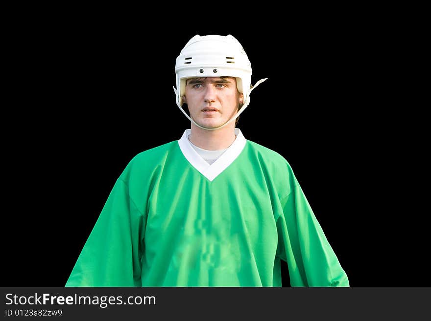 A young hockeyball player on the black background