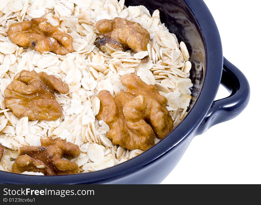 A bowl of oatmeal with walnuts - healthy diet