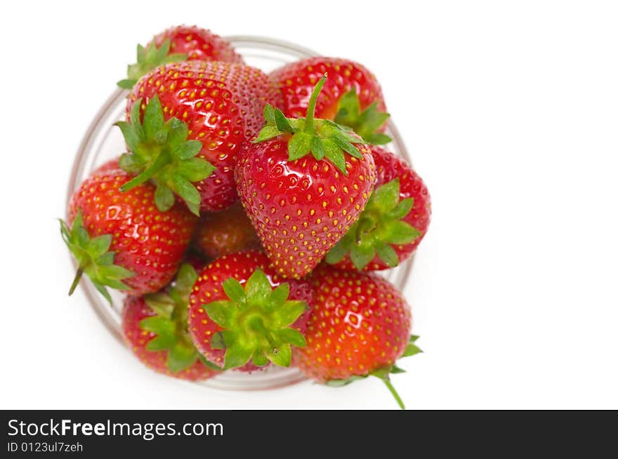 High key photo of fruit dish filled with nice red strawberries. High key photo of fruit dish filled with nice red strawberries