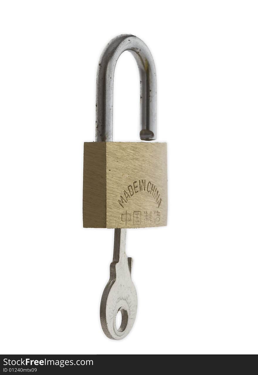 Small brass padlock with key inserted