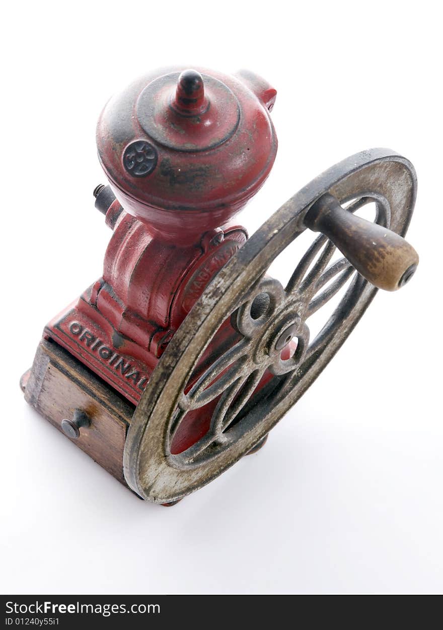 Red cast iron, antique Spanish Coffee Grinder with side wheel and wooden collection tray