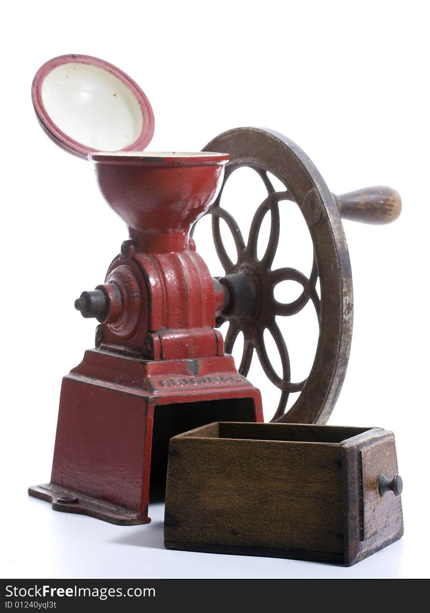 Red cast iron, antique Spanish Coffee Grinder with hand-cranked side wheel and wooden collection drawer