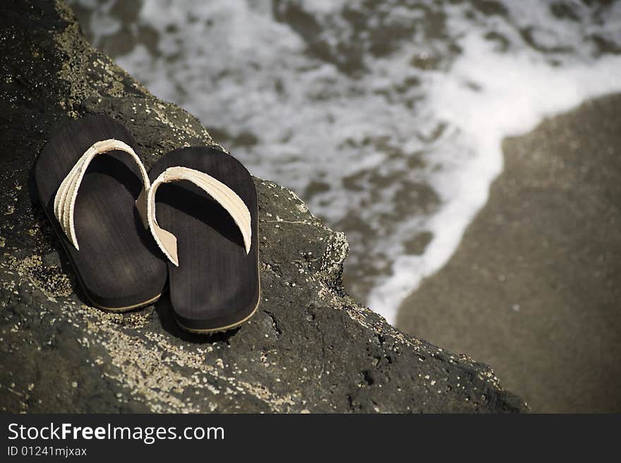 Sandals by the shore