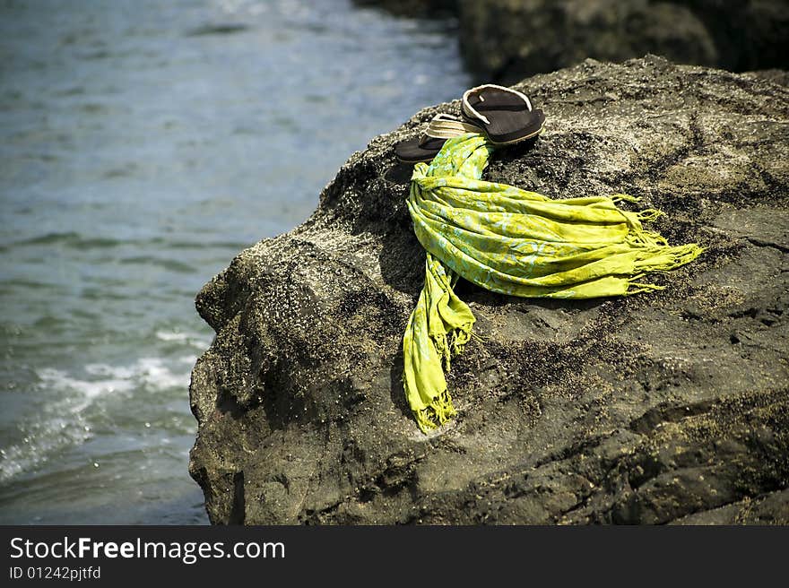 Sandals by the shore