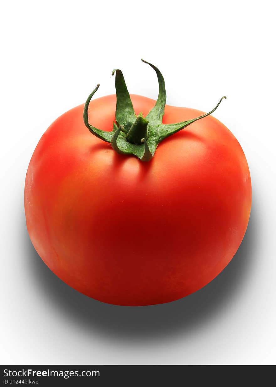 Single red tomato isolated on white with clipping path, studio lighting, drop shadow created in different layers. Single red tomato isolated on white with clipping path, studio lighting, drop shadow created in different layers