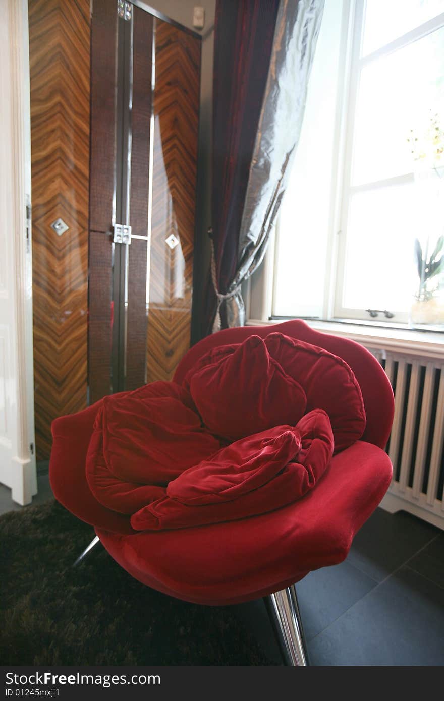 Interior with red chair in stylish form