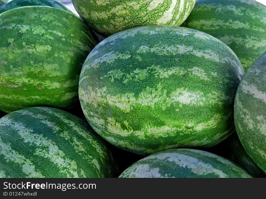 Whole watermelons at the market. Whole watermelons at the market.