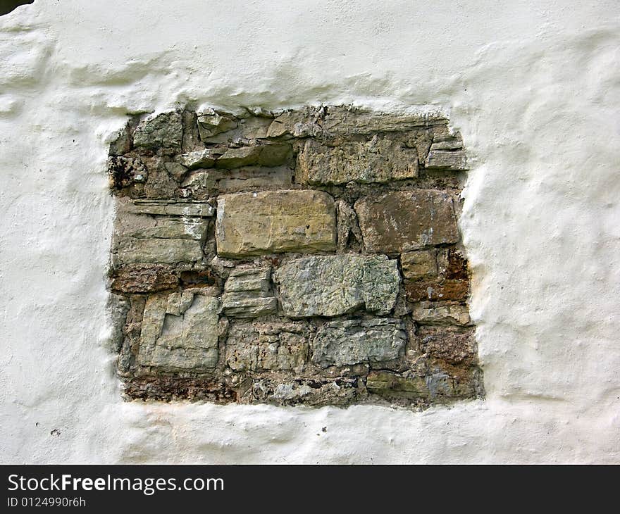 Old window in a wall of a church. Old window in a wall of a church