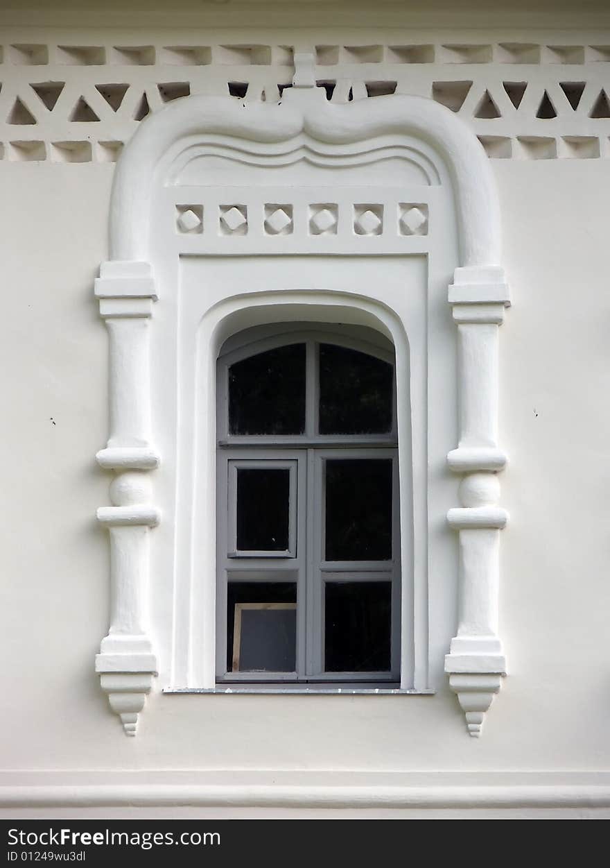 Old window in a wall of a church. Old window in a wall of a church