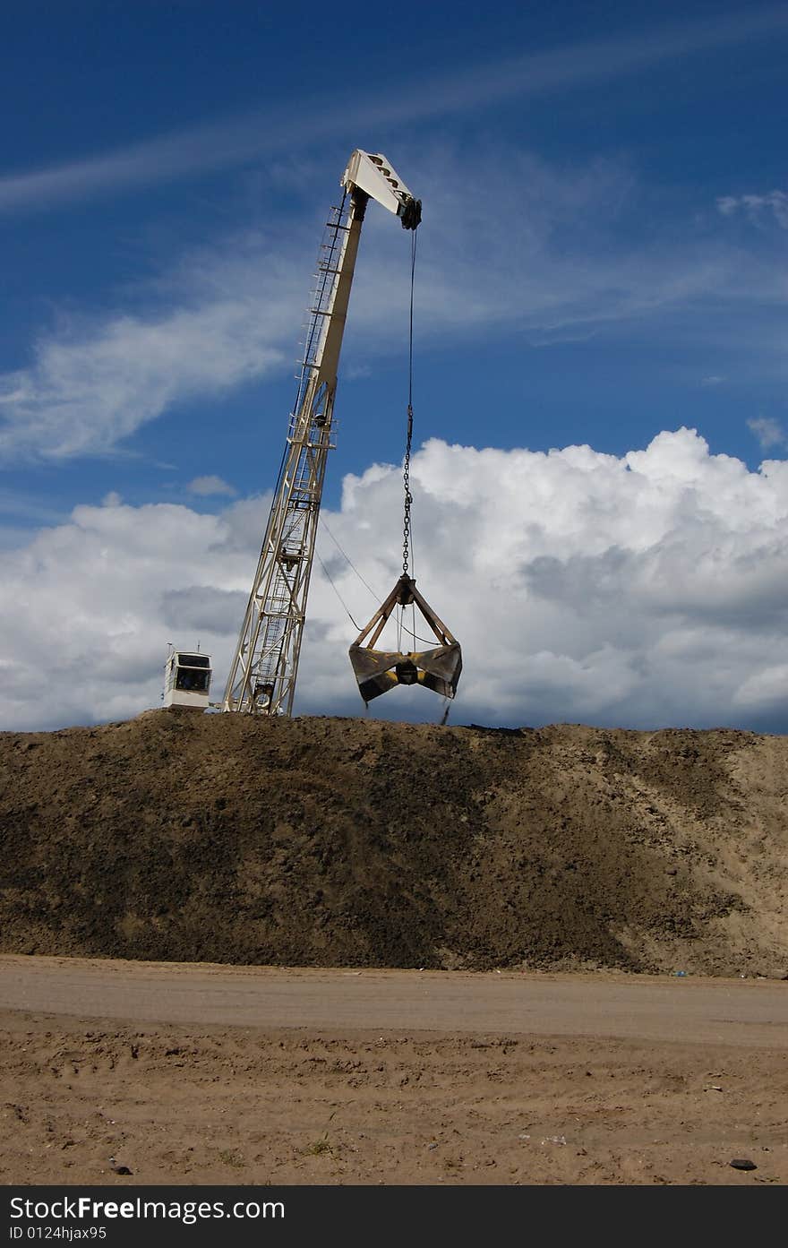 The port dredge unloads sand from the barge