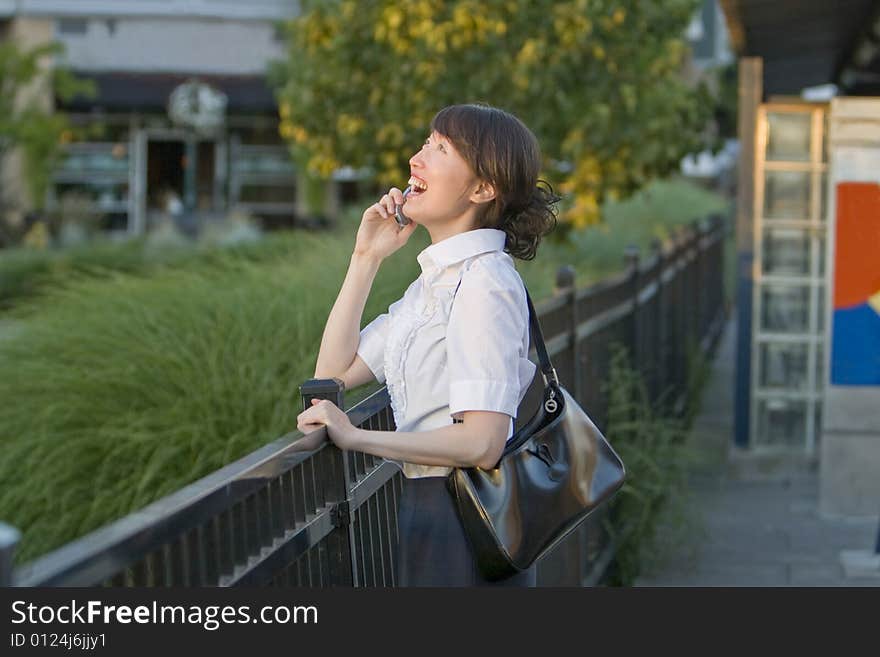 Woman Laughing on Cellular Phone - horizontal