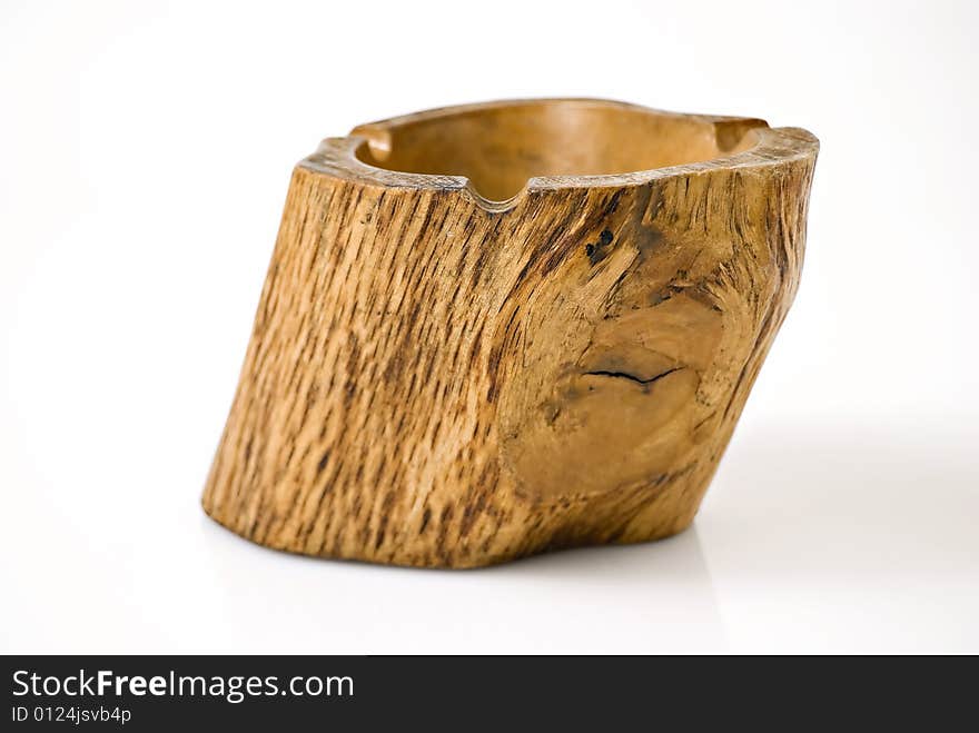 Closeup of wooden ashtray against white background