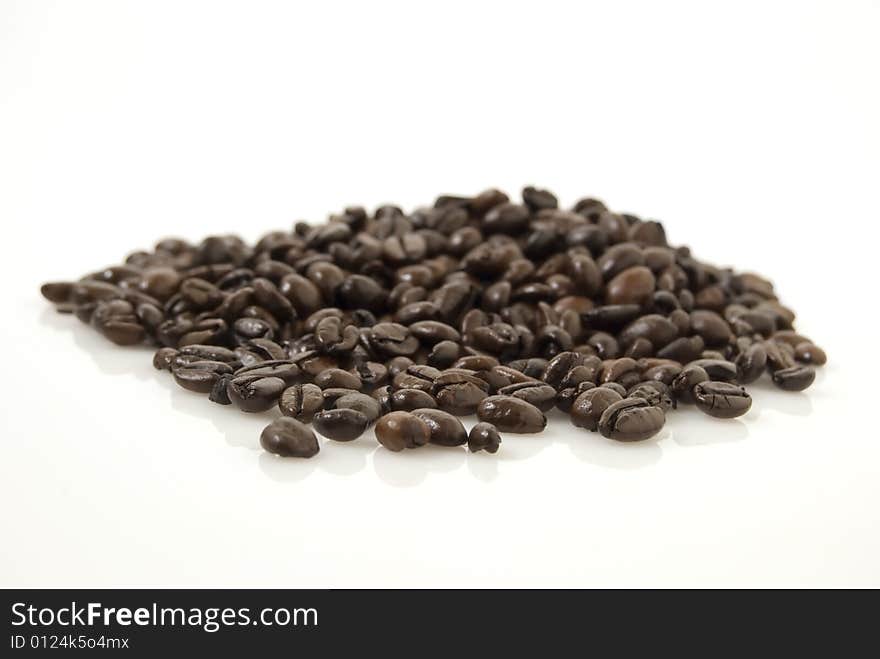 Closup shot of coffee beans against white background