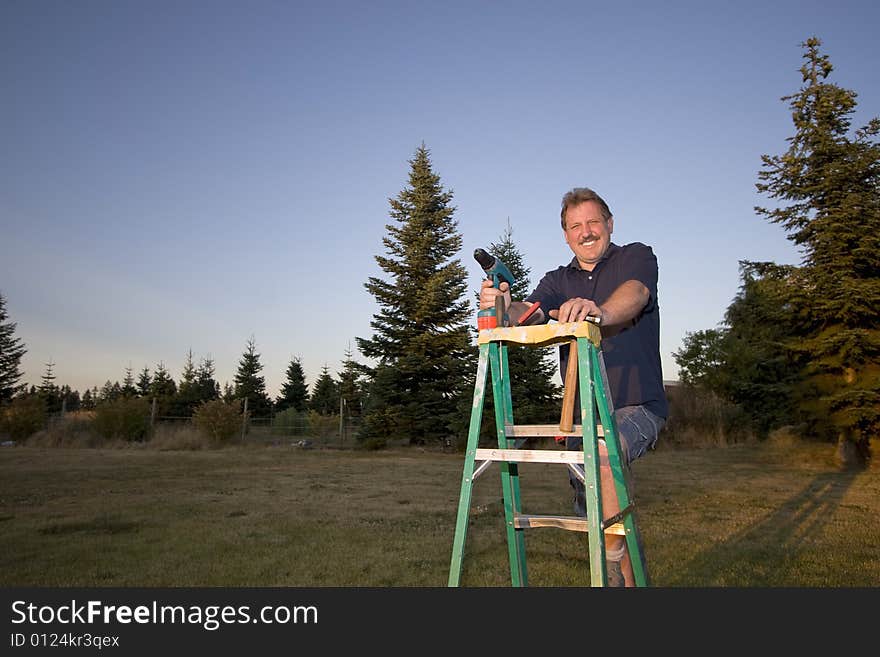 Man On Ladder - Horizontal