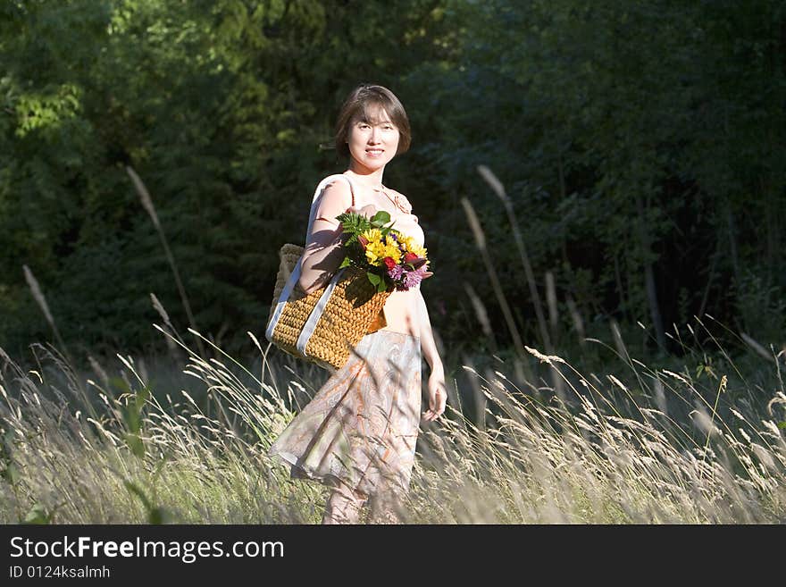 Woman In A Field Of Grass Smiling - Vertictal