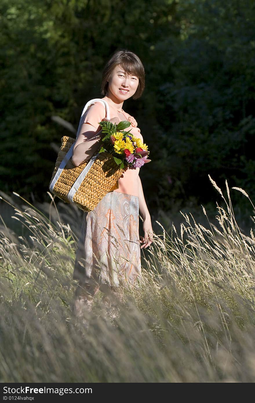 Woman In A Field Of Grass Smiling - Vertictal