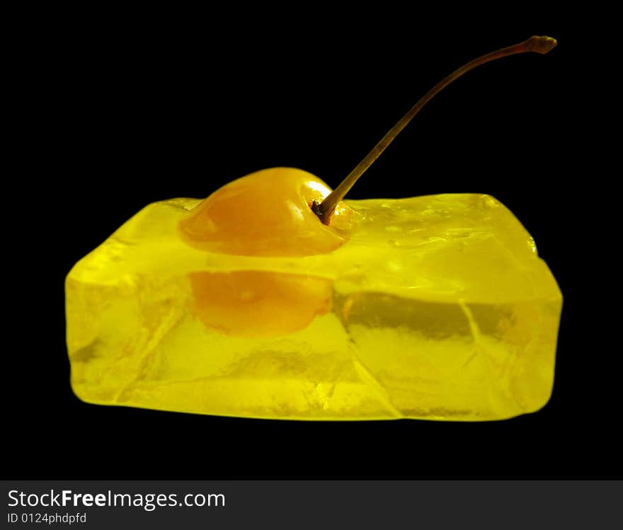 Yellow cherry frozen in jelled cube. Yellow cherry frozen in jelled cube