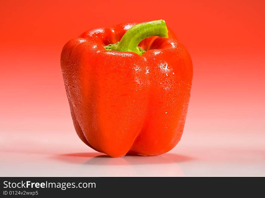 Red bell pepper lit with red gradient lighting. Red bell pepper lit with red gradient lighting