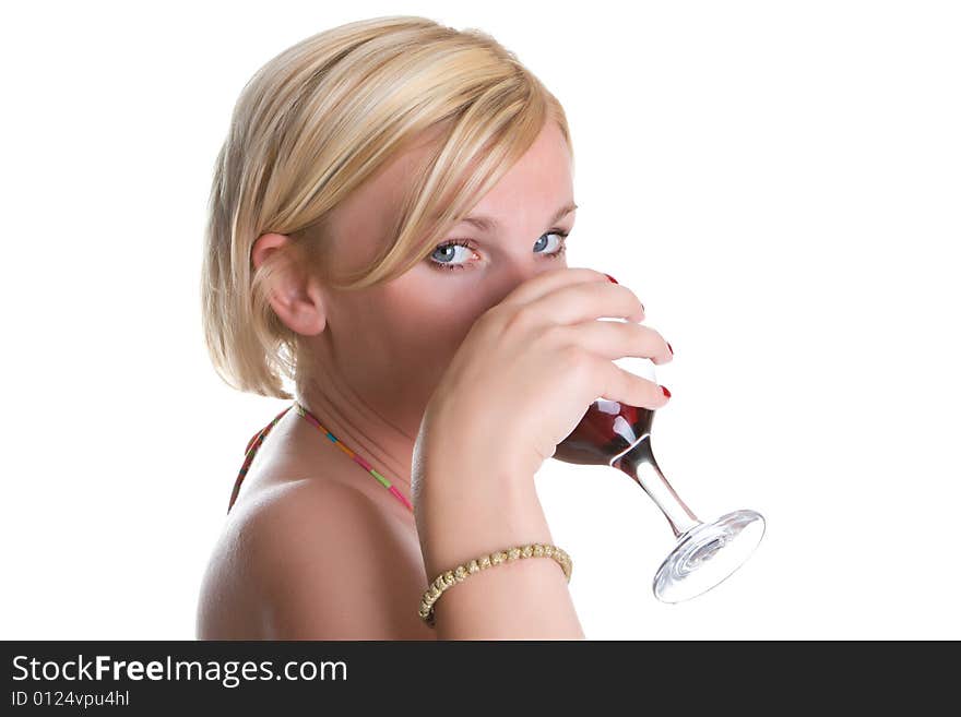 Young nice woman drinks wine from a glass isolated on a white background. Young nice woman drinks wine from a glass isolated on a white background