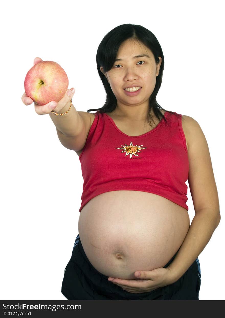 Young woman holding red apple with white background. Young woman holding red apple with white background