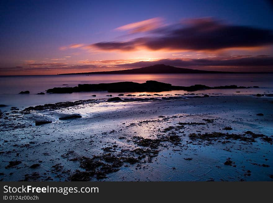 A view of rangitoto island from Auckland's North Shore. Taken at sunrise. A view of rangitoto island from Auckland's North Shore. Taken at sunrise.