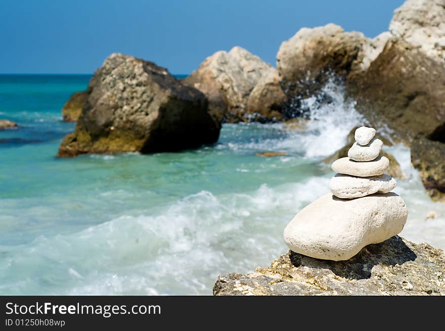 Stacked Pebbles On Rocky Beach