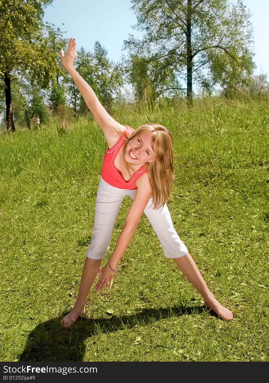 Young Girl Works Out In The Park