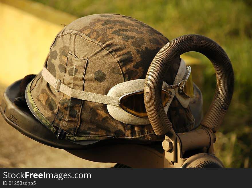 Helmet and gun on the motor-cycle. Helmet and gun on the motor-cycle