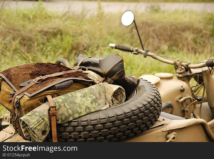 Helmet and gun on the motor-cycle. Helmet and gun on the motor-cycle