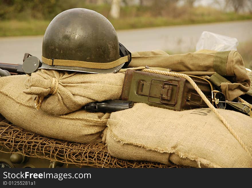 Helmet and gun on the motor-cycle. Helmet and gun on the motor-cycle