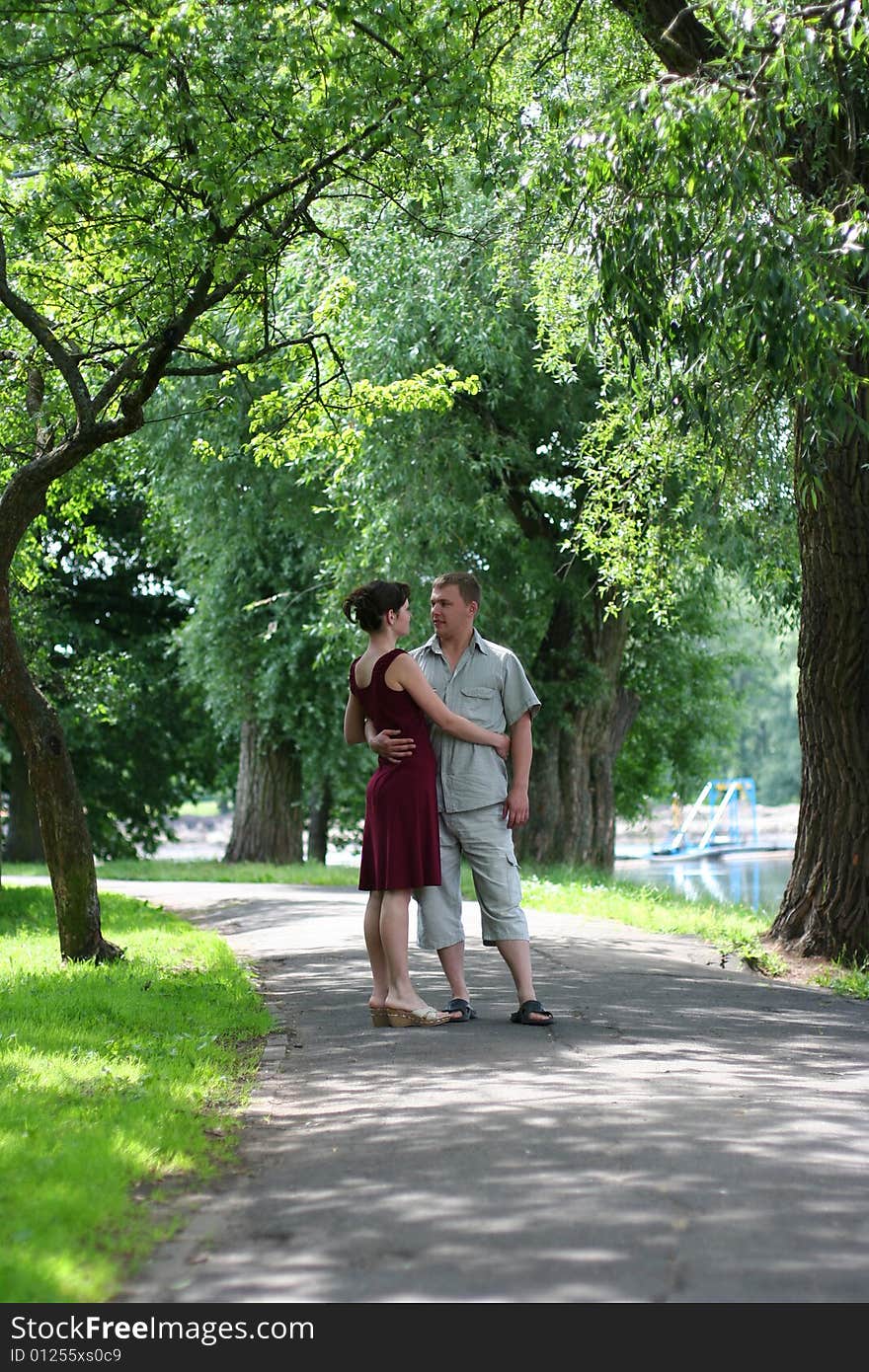 Loving couple walking in park. Loving couple walking in park