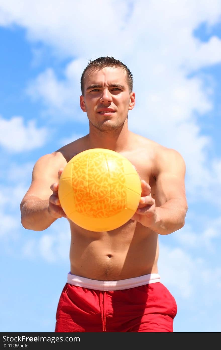 Guy with yellow ball outdoors. Guy with yellow ball outdoors