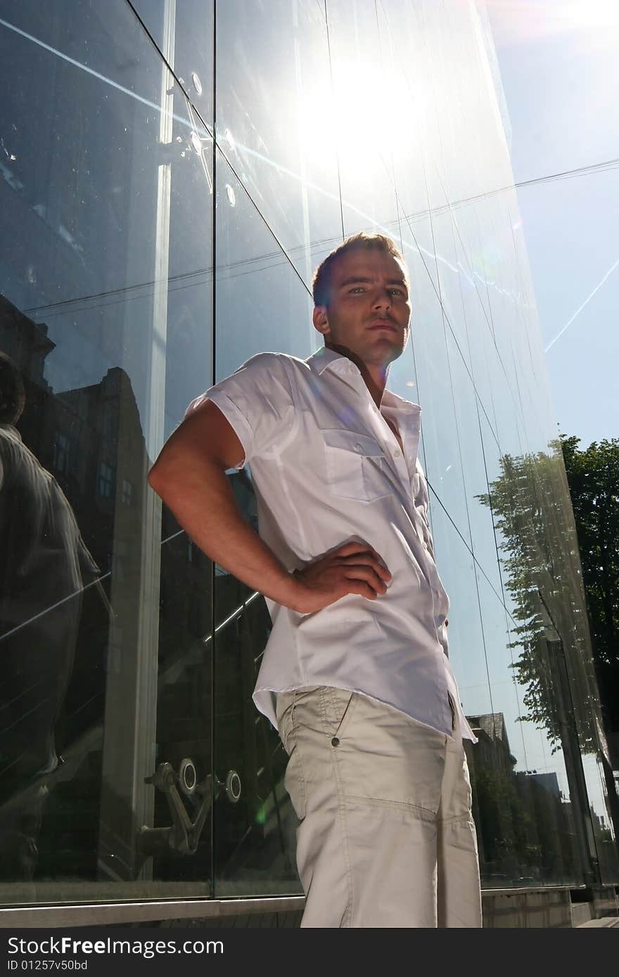 Handsome young guy near modern building. Handsome young guy near modern building