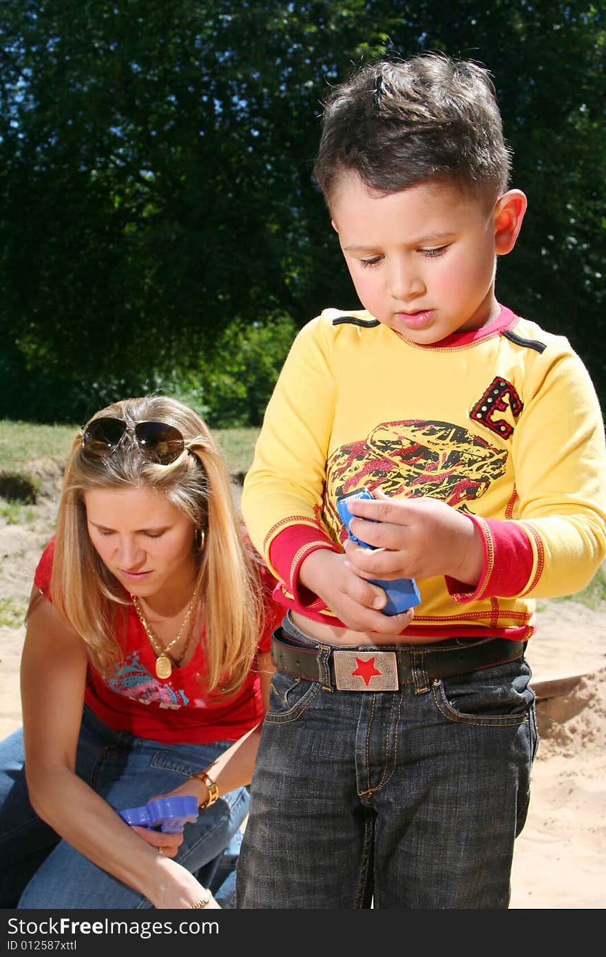 Young mother with cute son (boy in focus)